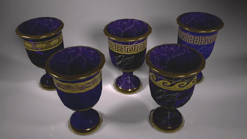Four dark marble chalices with gold rims and Greek key patterns
